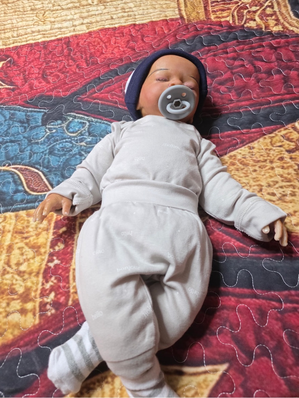 Hand painted silicone reborn baby doll.